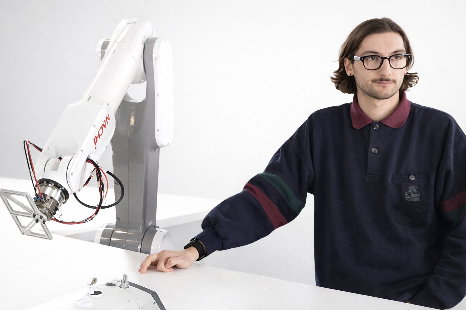 ADOTC team working on robotic textile automation in the workshop