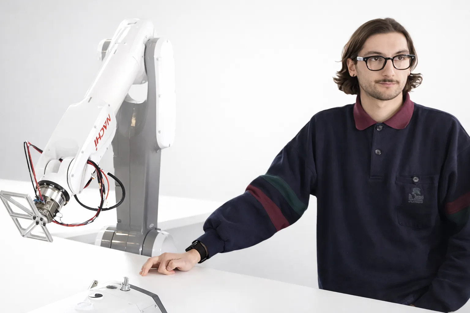 ADOTC team working on robotic textile automation in the workshop