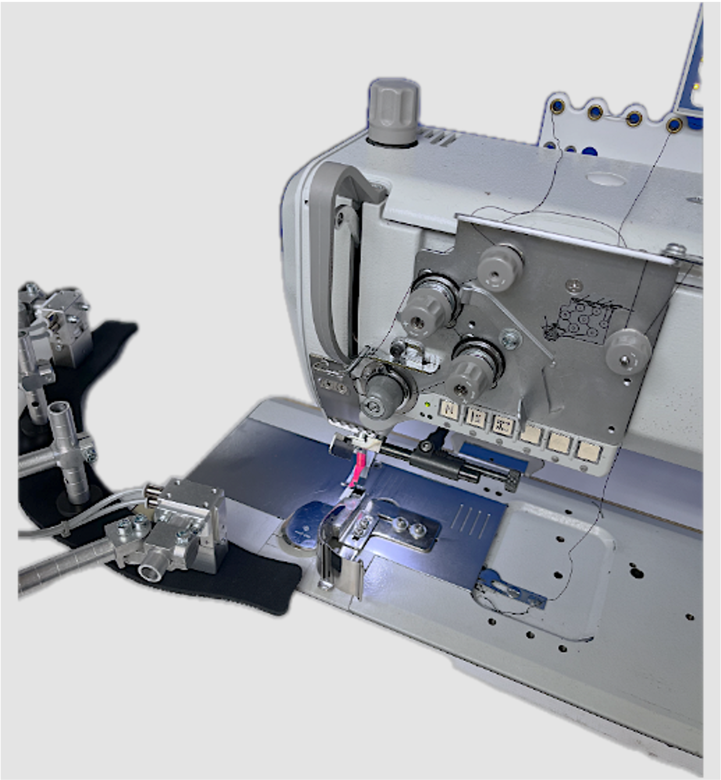 Technology setup with robot, gripper, sewing machine and camera