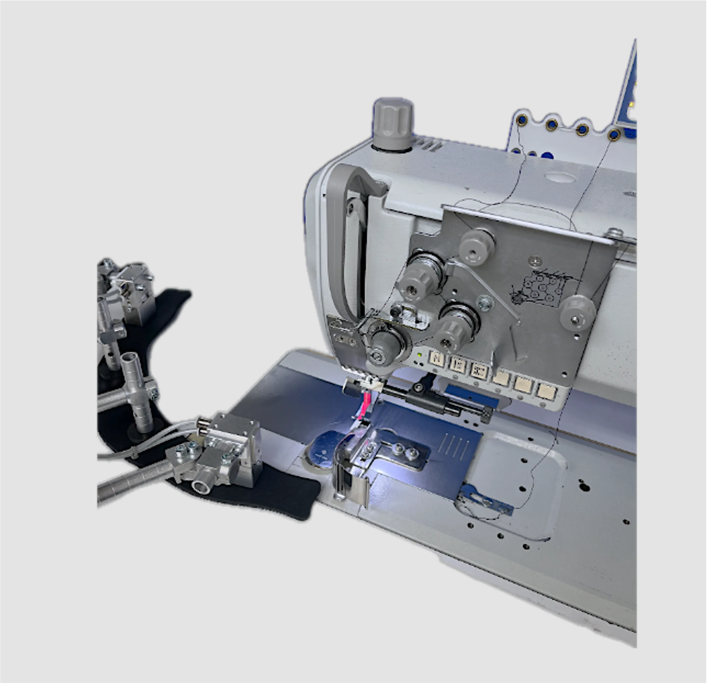 Technology setup with robot, gripper, sewing machine and camera